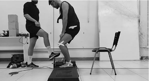 Figure 1. The initial position of the flywheel exercise is where the participant prepares to begin the squat movement.